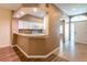Inviting entryway showcasing the kitchen with granite countertops and a view of the front door at 19025 Callaway Ct, Tampa, FL 33647