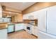Bright kitchen featuring white cabinets, granite countertops, and stainless steel appliances at 19025 Callaway Ct, Tampa, FL 33647
