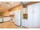 Spacious kitchen featuring stainless appliances, granite countertops, and white cabinetry at 19025 Callaway Ct, Tampa, FL 33647
