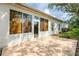 A sun-drenched rear patio features a seamless transition to the interior, with lots of windows at 19025 Callaway Ct, Tampa, FL 33647