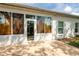 A sun-drenched rear patio features a seamless transition to the interior, with lots of windows at 19025 Callaway Ct, Tampa, FL 33647