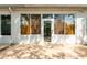 A sun-drenched rear patio features a seamless transition to the interior, with lots of windows at 19025 Callaway Ct, Tampa, FL 33647