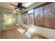 Sunroom features lots of windows, ceiling fan, and sliding glass doors at 19025 Callaway Ct, Tampa, FL 33647