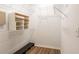 Walk-in closet with installed shelving and wood floor at 19025 Callaway Ct, Tampa, FL 33647