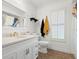Bathroom features white vanity with modern gold faucet and fixtures at 1951 Downing Pl, Palm Harbor, FL 34683