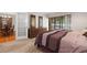 Bedroom boasts a large window and carpeted floors, as well as stylish, matching dressers at 1951 Downing Pl, Palm Harbor, FL 34683