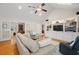Spacious living room provides ample seating and a view through French doors to a home office space at 1951 Downing Pl, Palm Harbor, FL 34683