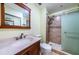 Bathroom featuring a glass-enclosed shower, vanity, and ample lighting at 2117 Lakewood Club S Dr # 7K, St Petersburg, FL 33712