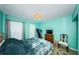 Bright bedroom featuring modern lighting, and a view of the exterior at 2117 Lakewood Club S Dr # 7K, St Petersburg, FL 33712