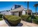 The clubhouse with its modern design is surrounded by lush landscaping and tall palm trees at 2117 Lakewood Club S Dr # 7K, St Petersburg, FL 33712