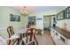 A delightful eat-in kitchen area showcases the dining table, chairs, and access to the rest of the house at 2117 Lakewood Club S Dr # 7K, St Petersburg, FL 33712