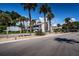 Casablanca community sign surrounded by lush landscaping and towering palm trees against a blue sky at 2117 Lakewood Club S Dr # 7K, St Petersburg, FL 33712