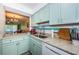 This kitchen offers a clear view of the dining and living areas, creating an open and inviting space at 2117 Lakewood Club S Dr # 7K, St Petersburg, FL 33712