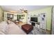 Bright and spacious living area featuring a dining area, entertainment center, and comfortable sofa at 2117 Lakewood Club S Dr # 7K, St Petersburg, FL 33712