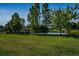 Scenic pond view with lush greenery and a charming gazebo, creating a tranquil atmosphere at 2117 Lakewood Club S Dr # 7K, St Petersburg, FL 33712