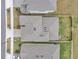 An aerial view of the home showcasing the roof, yard, and proximity to neighboring houses at 22294 Storybook Cabin Way, Land O Lakes, FL 34637
