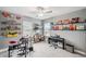 Inviting bedroom with a ceiling fan, shelves and musical instruments at 22294 Storybook Cabin Way, Land O Lakes, FL 34637