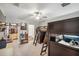 bedroom featuring bunkbeds, desk, and a view into the walk in closet and bathroom at 22294 Storybook Cabin Way, Land O Lakes, FL 34637