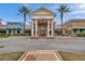 Community clubhouse with stately columns and well maintained landscaping at 22294 Storybook Cabin Way, Land O Lakes, FL 34637