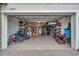 Spacious garage with epoxy flooring, storage shelves, and ample room for vehicles and equipment at 22294 Storybook Cabin Way, Land O Lakes, FL 34637