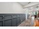 Hallway featuring decorative wall accents, and wood look floors at 22294 Storybook Cabin Way, Land O Lakes, FL 34637