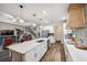Spacious kitchen with a large island, stainless steel appliances, and seamless flow into the living area at 22294 Storybook Cabin Way, Land O Lakes, FL 34637