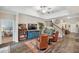 Elegant living room features hardwood floors, cozy seating, a staircase, and stylish decor at 22294 Storybook Cabin Way, Land O Lakes, FL 34637