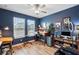 Office space with hardwood floors, two windows, and ceiling fan at 22294 Storybook Cabin Way, Land O Lakes, FL 34637