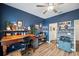 Office space featuring hardwood floors, a desk, and decorative accessories at 22294 Storybook Cabin Way, Land O Lakes, FL 34637