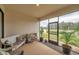 Relaxing screened patio with comfortable seating and view of the yard at 22294 Storybook Cabin Way, Land O Lakes, FL 34637