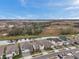 A street view showcases houses near a pond, highlighting community living and serene natural surroundings at 22294 Storybook Cabin Way, Land O Lakes, FL 34637
