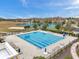 Community pool featuring a large pool, lounge chairs, and well-maintained landscaping, perfect for relaxation at 22294 Storybook Cabin Way, Land O Lakes, FL 34637