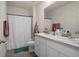 Bathroom featuring a double sink vanity and a shower with white curtain at 2449 Moon Shadow Rd, New Port Richey, FL 34655
