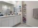 Bright bathroom with double sink vanity and plenty of storage at 2449 Moon Shadow Rd, New Port Richey, FL 34655