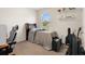 Bedroom with natural light featuring a bed, desk, and simple decor at 2449 Moon Shadow Rd, New Port Richey, FL 34655