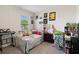 Charming bedroom with a window, featuring colorful decor, and wall art at 2449 Moon Shadow Rd, New Port Richey, FL 34655