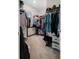 Walk-in closet with carpet, wire shelving, and room to store clothing and accessories at 2449 Moon Shadow Rd, New Port Richey, FL 34655