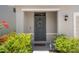 Inviting front door with a decorative wreath and fresh landscaping at 2449 Moon Shadow Rd, New Port Richey, FL 34655