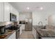 Modern kitchen featuring granite countertops, stainless steel appliances and white cabinets at 2449 Moon Shadow Rd, New Port Richey, FL 34655