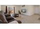 Cozy living room featuring comfortable seating, a decorative rug, and access to the patio at 2449 Moon Shadow Rd, New Port Richey, FL 34655
