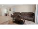 Comfortable living room with neutral walls, large sofas, a decorative rug, and modern tiled flooring at 2449 Moon Shadow Rd, New Port Richey, FL 34655