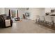 Open living space with stylish furnishings and access to an outdoor patio at 2449 Moon Shadow Rd, New Port Richey, FL 34655