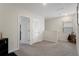 Open upstairs loft area with neutral walls, lots of natural light, and carpeted floors at 2449 Moon Shadow Rd, New Port Richey, FL 34655