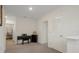 Upstairs loft area with neutral walls and carpeted floors, perfect for a home office or play area at 2449 Moon Shadow Rd, New Port Richey, FL 34655