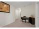 Spacious loft with a piano, neutral walls, and carpeted floors at 2449 Moon Shadow Rd, New Port Richey, FL 34655