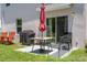 Back patio with a barbecue, sliding glass doors, patio table and chairs, and green grass perfect for relaxing and entertaining at 2449 Moon Shadow Rd, New Port Richey, FL 34655