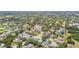 Extensive aerial view showcasing a densely populated residential area with tree-lined streets and diverse housing styles at 2667 Aspen Ct, Palm Harbor, FL 34684