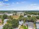 Aerial view of home located near a bustling commercial area with retail stores and restaurants at 2667 Aspen Ct, Palm Harbor, FL 34684