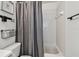 Bathroom featuring a tub and shower with gray curtain at 2667 Aspen Ct, Palm Harbor, FL 34684