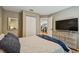 Bedroom with neutral walls, queen bed, and view into home office at 2667 Aspen Ct, Palm Harbor, FL 34684